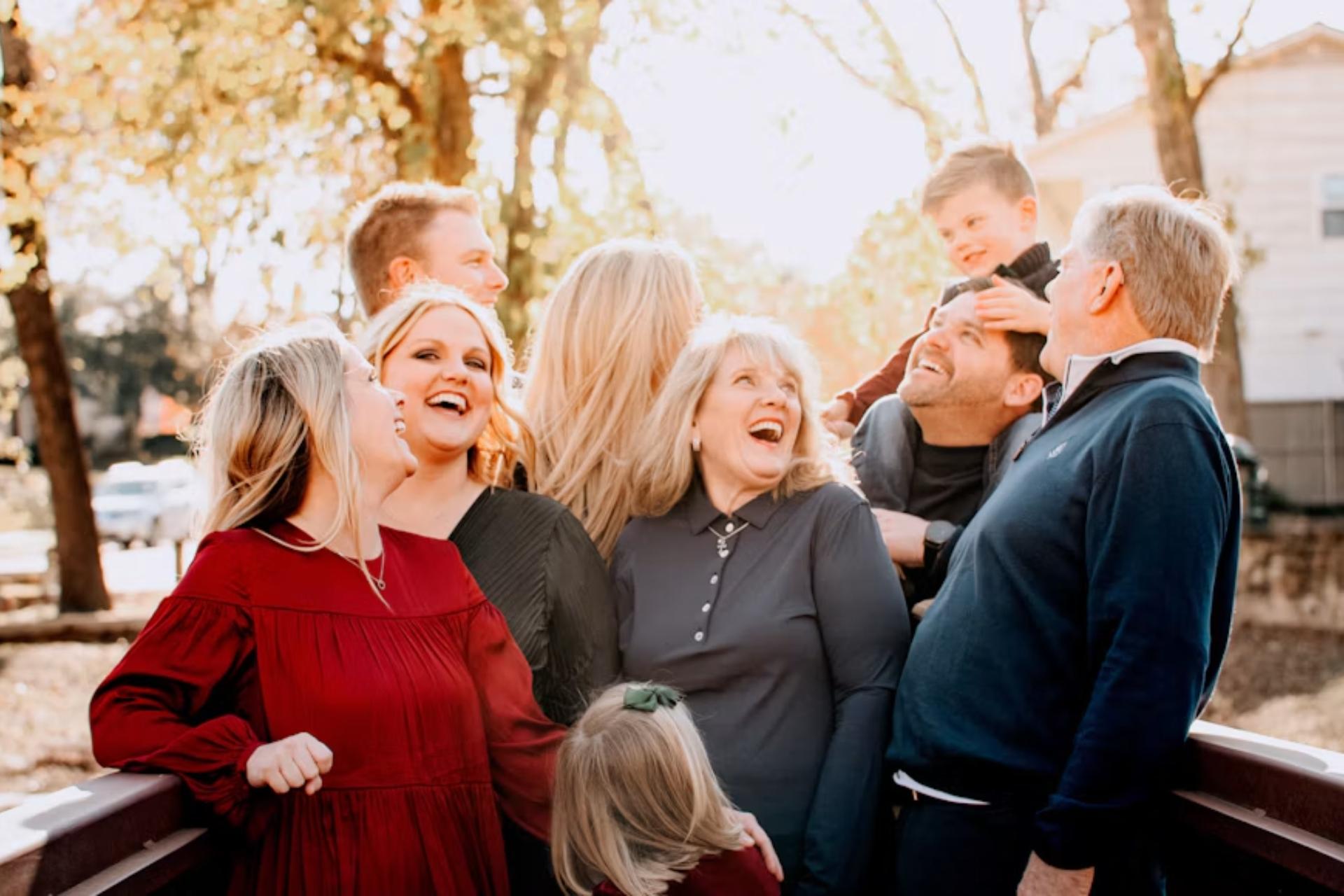 a Canadian family laughing while basking in the autumn breeze